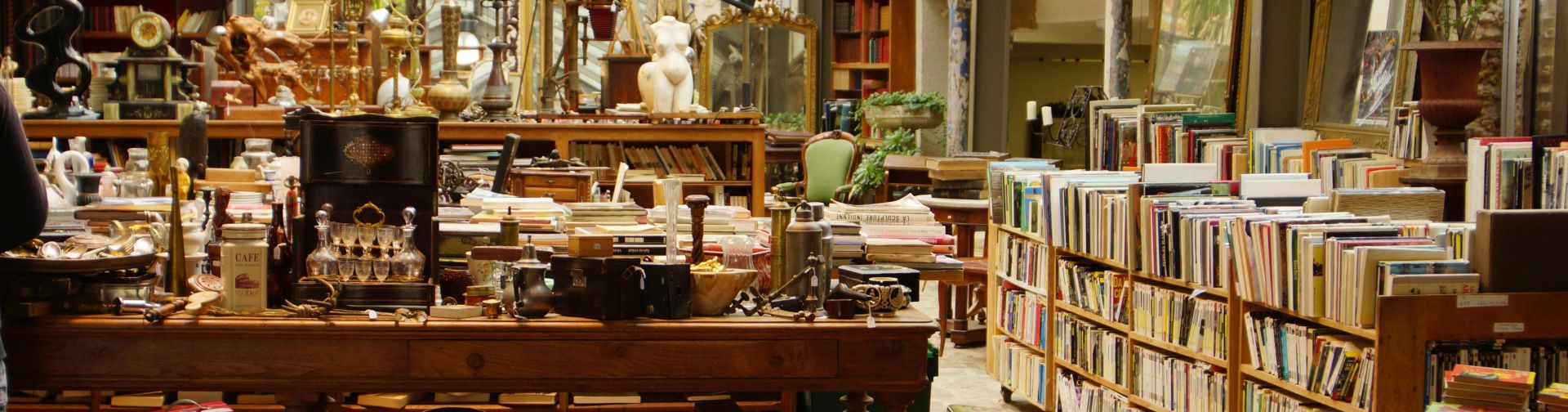 Explore this cozy Parisian vintage bookshop overflowing with books and antiques.